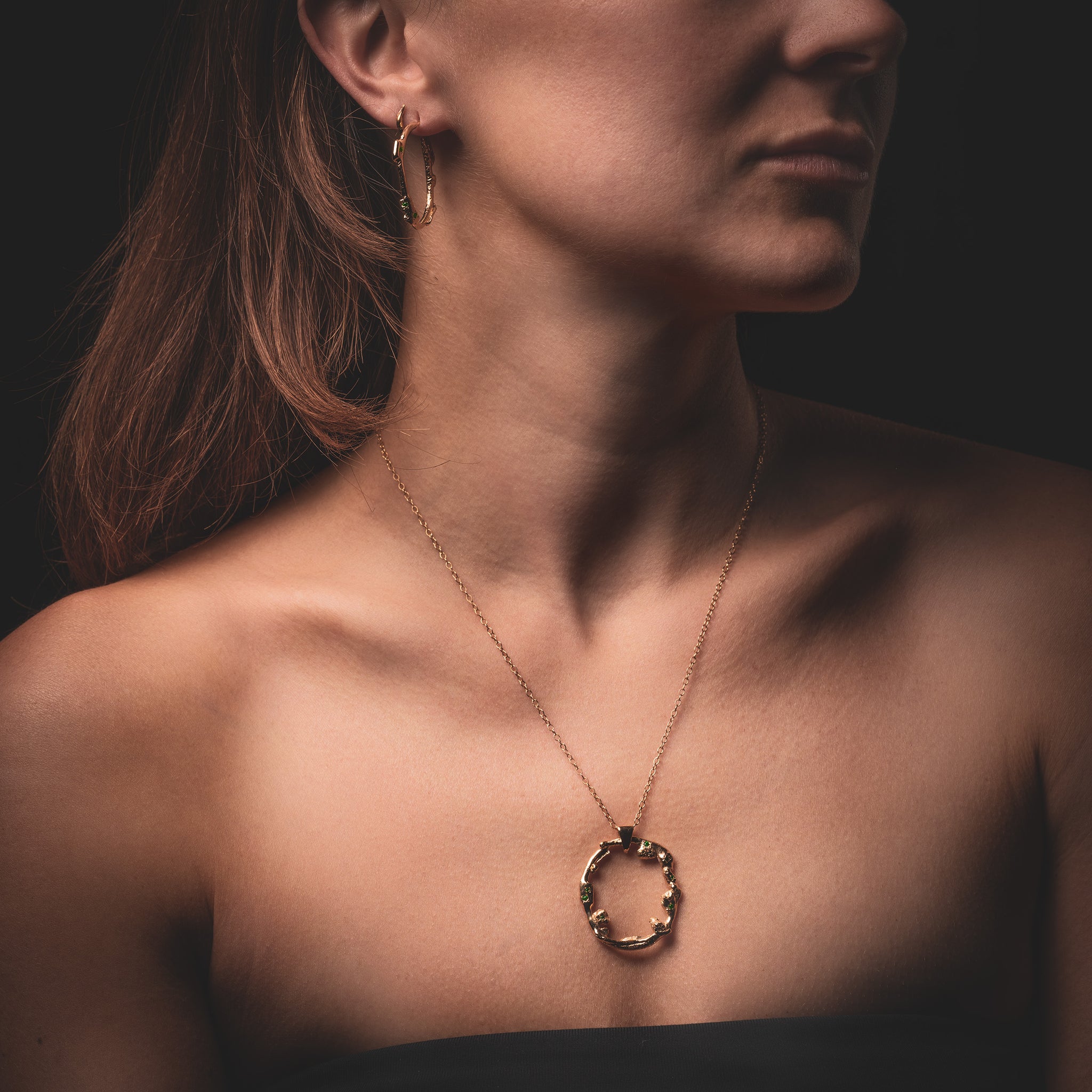 Women wearing a long Taormina Necklace with Green Emeralds by What If You Stayed Artist Jewelry