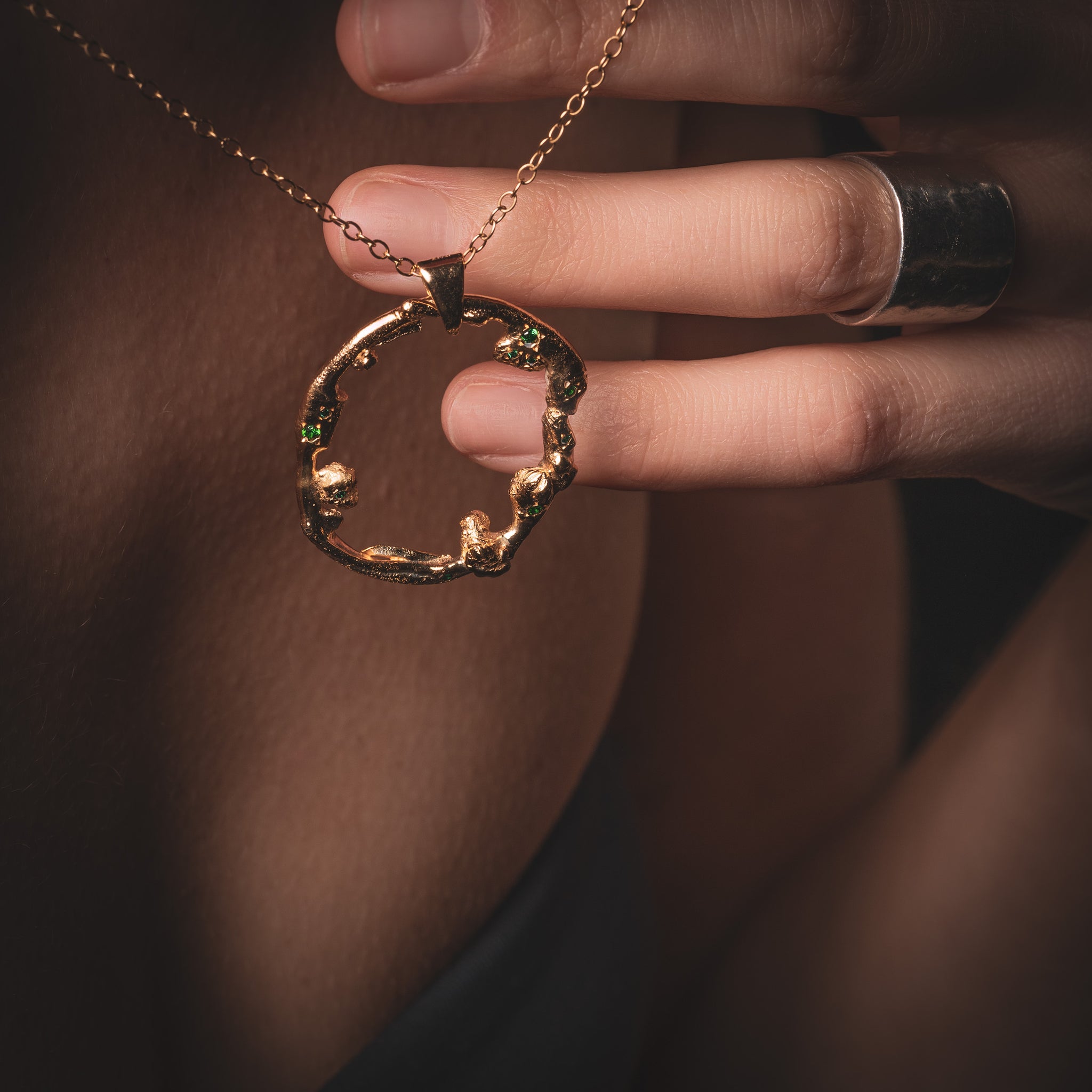 Close up of a Women wearing a long Taormina Necklace with Green Emeralds by What If You Stayed Artist Jewelry